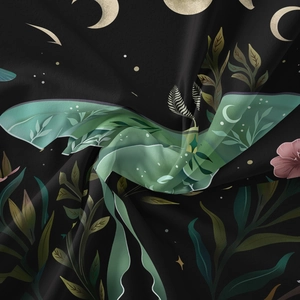 Close-up of bohemian Luna Moth tapestry fabric texture with moon and star patterns