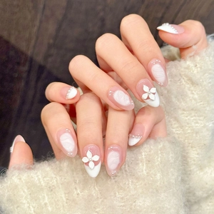 Handmade press-on nails with 3D white flowers, pearls, and nude pink French style