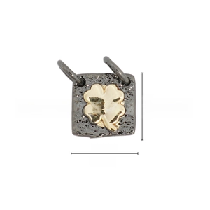 Macro detail of a 9.1mm square four-leaf clover pendant with vintage black silver texture