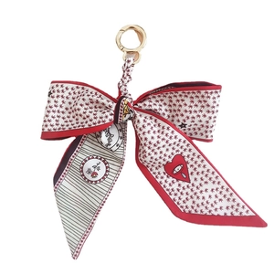 Camellia silk ribbon bow keychain with golden metal clasp and red floral heart pattern