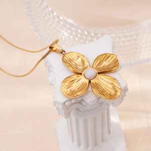 Elegant gold stainless steel four-petal flower necklace with white bead on a snake chain