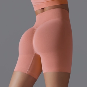 Detail view of seamless high-waisted yoga shorts with V-shaped peach butt lifting design