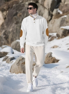 Outdoor street style shot of men's white waffle knit polo with brown elbow patches