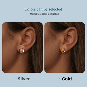 Detail view of square geometric S925 sterling silver hoop earrings in gold and silver