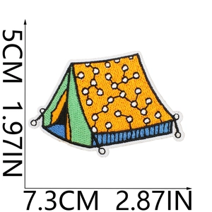 Detailed view of yellow and green embroidered camping tent patch with measurement scale
