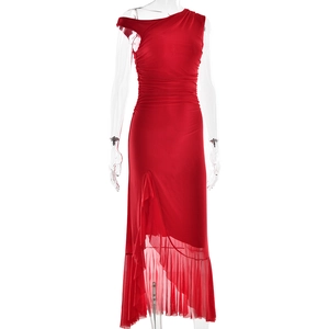 Detail of red one-shoulder ruched dress with asymmetrical tulle hem on mannequin