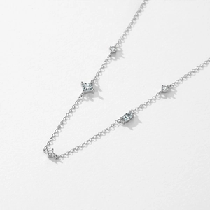 Minimalist S925 sterling silver necklace with five sparkling zircon pendants on white background