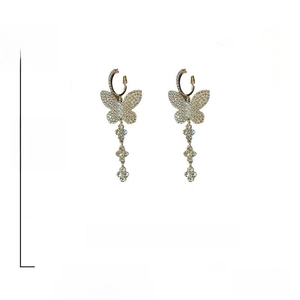Detail of butterfly drop earrings with pearls, crystals and 925 silver pins