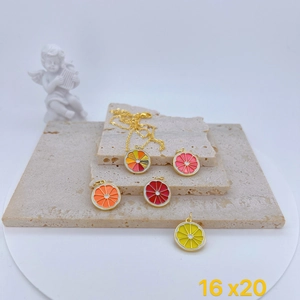 Close-up of golden fruit charms in orange and lemon slices with enamel finish, 16x20mm