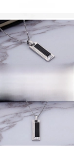 Macro shot of stainless steel necklace with engraved Love Devotion and black inlay