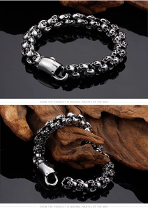 Detailed view of punk style skull head link bracelet with secure lobster clasp for men