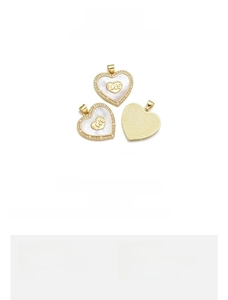 Detail of 23x24mm 18K gold-plated heart pendant with natural shell and LOVE engraving