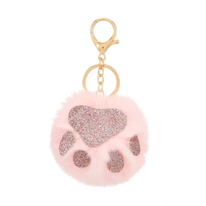 Rosa Schlüsselanhänger aus Kunstpelz mit glitzernder Katzenpfote und Goldring