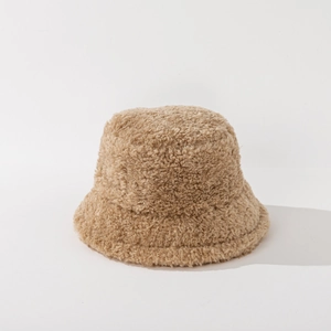 Detailed close-up showing the soft camel plush texture and round crown of this bucket hat