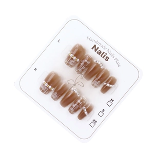 Handmade brown gradient press-on nails with white lines, pearls and crystal rhinestones