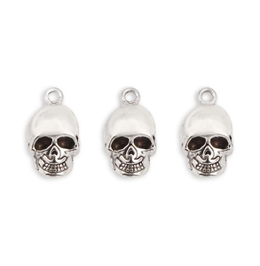 Three antique silver skull pendants for DIY jewelry with detailed oxidization
