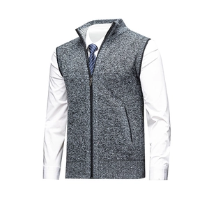 Men's dark grey knitted zip-up vest with stand collar over white shirt and blue striped tie