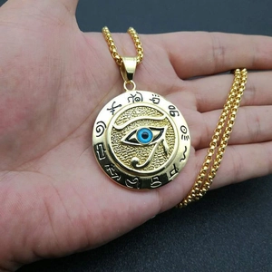 Ancient Egyptian Eye of Horus gold pendant necklace with blue eye and hieroglyphs