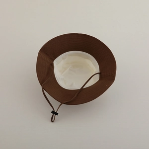 Kids color-block bucket hat in dark brown canvas with adjustable chin strap and lining