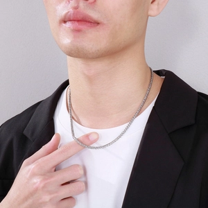 Men's silver stainless steel wheat chain necklace worn by model in business casual suit