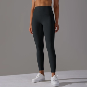 Close-up of high-waisted black yoga pants showing seamless shaping and matte texture