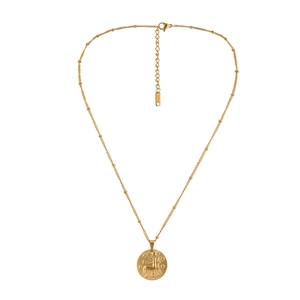 Close-up of golden stainless steel coin necklace featuring detailed zodiac relief carving