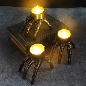 Three-piece set of Halloween skeleton hand LED candle lights with gold-brushed finish