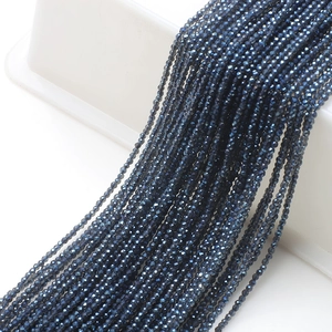Macro view of 2mm faceted navy blue glass beads for DIY necklaces and jewelry making