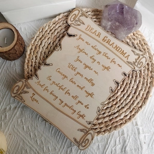 Detail of wooden grandma plaque with laser engraved poem on a cozy textured background