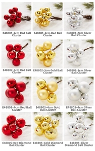 Macro detail of glossy and matte Christmas ball ornaments in red, gold and silver finishes