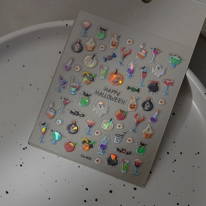 3D laser Halloween nail art stickers with ghosts and pumpkins on a white tray
