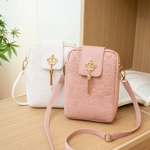 Chic embossed leather cell phone crossbody bags in white and pink with crown tassel charms