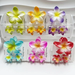 Frangipani flower hair claw clip set with vibrant gradient colors for beach vacations