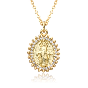 Detail of 18k gold plated religious medallion necklace with Virgin Mary and cubic zirconia