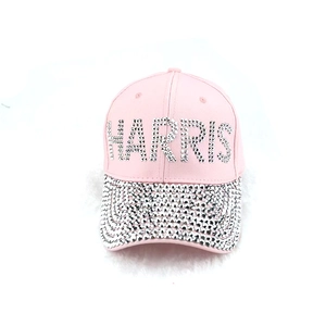 Pink baseball cap featuring sparkly rhinestones and HARRIS letter decoration