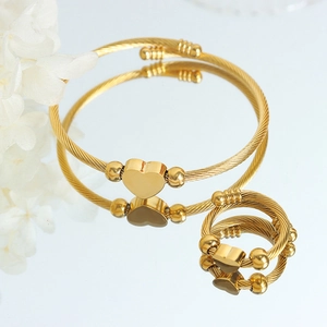 Golden heart-shaped wire jewelry set with polished bracelet and matching ring