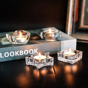 Minimalist clear glass tea light candle holders in heart, star, and round shapes