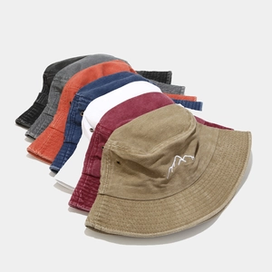 Washed cotton bucket hat with mountain embroidery in multiple vintage colors for outdoor wear