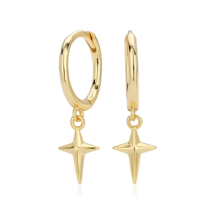 Macro detail of gold four-pointed star charm on polished silver hoop earrings
