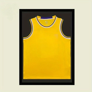 Detail of yellow basketball jersey display in black magnetic frame with striped trim