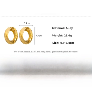 Close-up of golden twisted oval hoop earrings with alloy material and size specifications
