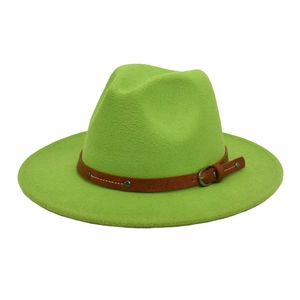 Detail view of neon green fedora hat with brown leather strap and metal rivet accents