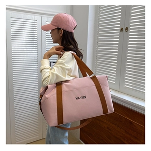 Pink large capacity yoga fitness travel bag with brown straps and HAYUN text print