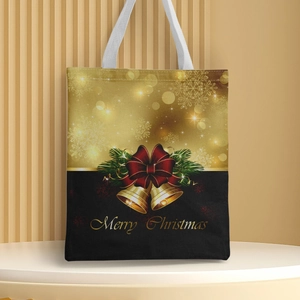 Detail of Christmas canvas tote bag featuring golden snowflakes and Merry Christmas text
