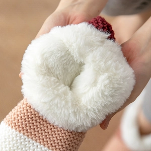 Pink and white knitted floor socks with thick white fleece lining and non-slip sole