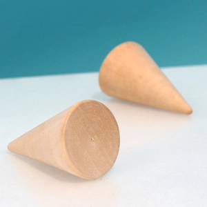 Minimalist wooden cone ring stand with natural grain for jewelry display on blue background