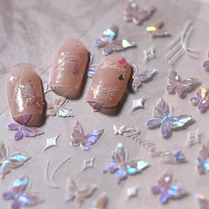 3D holographic butterfly nail stickers with gold foil and stars on soft pink nails
