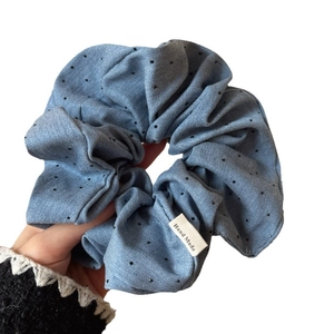 Blue denim fabric scrunchie with black polka dots and handmade label for women