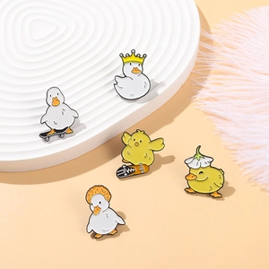 Cute cartoon enamel duck pins collection with crown and skateboard designs