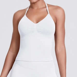 Detail of white seamless knitted halter sports top with V-neck pleats and high elasticity
